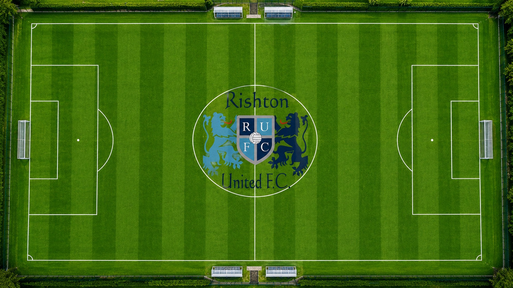 Aerial view of Rishton United FC's pitch at Norden Valley with the club emblem in the centre circle